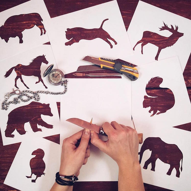 Paper cut-outs of animals filled with beautiful backdrops of nature