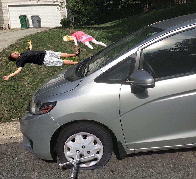 Photoshopped Flat Tire Scene – “Should’ve Took the Whole Week Off” Edited photo of a car with a flat tire and two people lying on the grass, captioned “Should’ve took the whole week off”