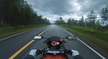 First-person view of a motorcycle riding on a forest road in a viral 3D animated road-safety video.