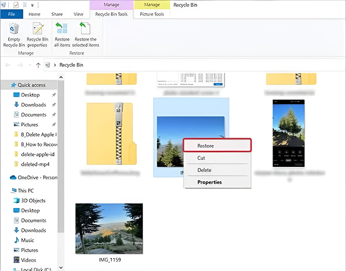 Right-clicking a photo in Windows Recycle Bin and selecting Restore to recover deleted images