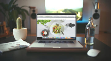 Modern workspace with laptop displaying a clean, responsive website design