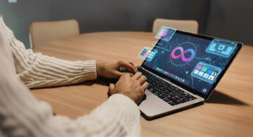 Designer using AI-powered tools on a laptop to automate branding tasks and streamline creative workflows