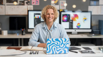 Photographer working with print on demand products in a creative studio setup