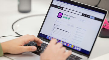 Person browsing online reviews on a laptop screen