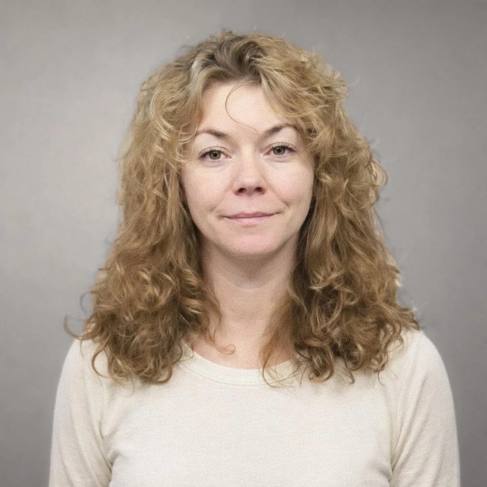 Restored portrait of a woman with softened lighting and improved clarity