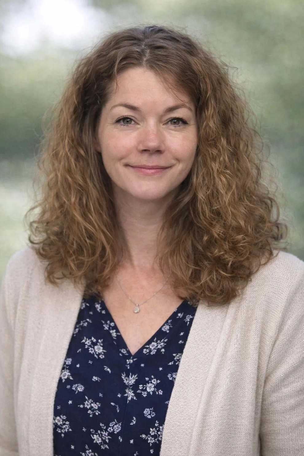 Natural-looking restored portrait of a woman with soft tones and clearer facial details
