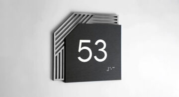 Signage That Helps Rental Properties Run Smoothly Modern property signage design with layered metal room number sign and raised numerals
