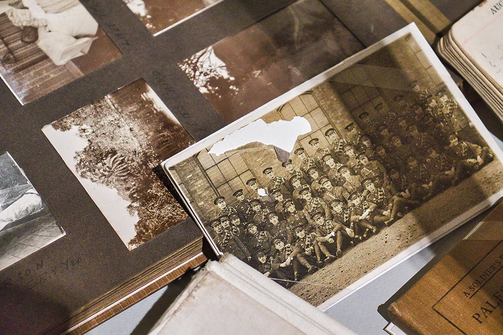 How to Restore a Damaged Photograph Torn and faded vintage photograph being preserved in an old photo album