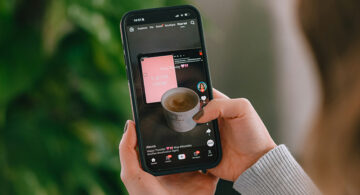 Person scrolling short-form video content on a smartphone