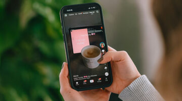 Person scrolling short-form video content on a smartphone
