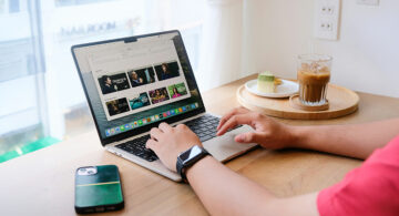 Person comparing streaming services on a MacBook at home