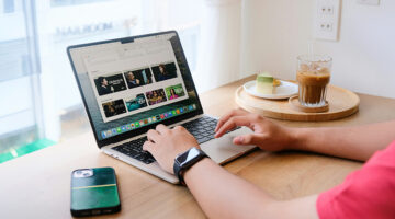 Person comparing streaming services on a MacBook at home