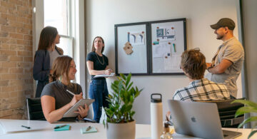 Creative team discussing workflow ideas during a collaborative office meeting