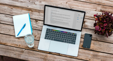 Laptop displaying a digital document on a desk
