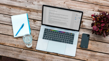 Laptop displaying a digital document on a desk