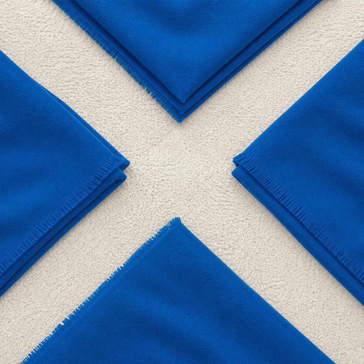 Scotland flag recreated with blue blankets arranged around a white diagonal cross using IKEA textiles