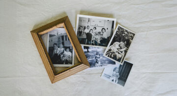 Vintage family photographs and a framed portrait representing personalized art and cherished memories