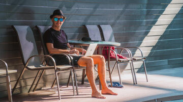 Digital nomad working on a laptop while traveling abroad