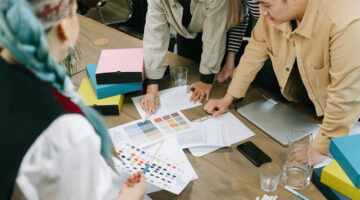 Creative team reviewing content and design for errors