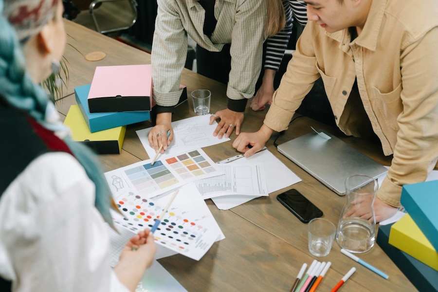 Creative team reviewing design files and content for errors