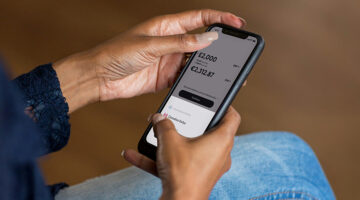 Student using a mobile banking app for money management