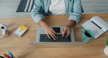 How Freelancers and Creative Professionals Can Enforce Payment Terms Without Damaging Client Relationships Freelancer working on a laptop managing client payments and invoices