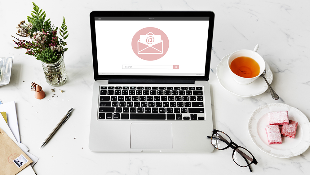 How Email Marketing Reflects Your Brand Laptop displaying an email icon, illustrating email marketing and brand identity